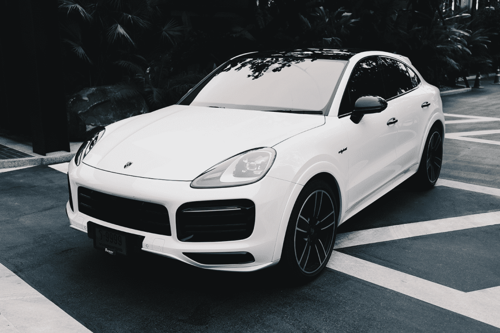 Starting at 32,900 Baht/1 Day

**Luxury SUV Experience: Porsche Cayenne Coupe 959 2021**

Rent a Porsche to indulge in a luxurious SUV with a stunning design, potent yet fuel-efficient 4.0L V8 engine, and lavish interior. The Cayenne Coupe 959 2021 boasts 570 horsepower and 770 Nm of torque, reaching a top speed of 286 km/h, all while maintaining an average fuel consumption of 11.4 km/l. Ideal for those seeking a premium SUV experience.

**Key Features:**
- **Performance:** 4.0L V8 engine, 570 hp, 770 Nm torque, and a top speed of 286 km/h.
- **Safety Features:** Advanced safety systems include automatic braking, front collision warning, adaptive cruise control, electrically adjustable steering wheel, stability control, and sport driving assistance.
- **Luxurious Interior:** Premium safety features, electrically adjustable front seats, and cutting-edge technology for a comfortable and secure driving experience.
- **Driving Dynamics:** Sporty driving features such as sport-tuned suspension, steering control, and parking assistance.

The Porsche Cayenne Coupe 959 2021 is available for rent starting at 6,990,000 Baht. It offers an outstanding SUV experience with a blend of performance, fuel efficiency, and advanced technology, catering to those seeking a premium SUV.

**Pros and Cons:**
*Pros:*
- Beautiful and modern design.
- Excellent performance.
- Fuel-efficient.
- Cutting-edge technology.
- Opulent and comfortable interior.

*Cons:*
- High price.
- Limited cargo space.
- Slightly narrow rear seating.

Overall, the Porsche Cayenne Coupe 959 2021 is an exceptional SUV, offering great value for its price, excellent performance, fuel efficiency, and advanced technology. Ideal for those in search of a premium SUV.