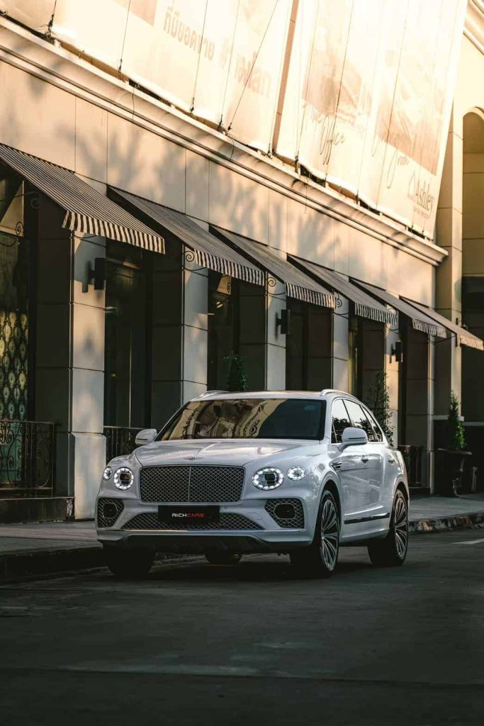 Starting at 89,000 baht/1 Day

**Engine Options:**

The Bentley Bentayga 2023 offers a selection of sophisticated powertrains, catering to a diverse range of preferences. Among the available options is a potent V8 engine, showcasing Bentley's commitment to delivering exceptional performance.

**Power Output:**

The Bentayga's engine options ensure commanding power, with the V8 variant delivering substantial horsepower and torque. While specific figures may vary, the V8 engine typically exceeds 500 horsepower, providing an exhilarating driving experience with robust torque delivery.

**Transmission:**

The Bentayga 2023 often features a seamless transmission system, frequently employing an advanced automatic transmission—ensuring a harmonious blend of power and efficiency. Bentley acknowledges driving enthusiasts by potentially offering a manual transmission option, enhancing the driving experience for those who appreciate hands-on control.

**Performance:**

Renowned for its remarkable performance, the Bentley Bentayga 2023 excels in rapid acceleration, precise handling, and impressive road manners. The vehicle attains high speeds effortlessly, providing an exhilarating driving experience with a perfect balance of power and agility.

**Exterior Design:**

The Bentayga 2023 boasts a distinctive and opulent exterior design, characterized by a commanding presence, sleek lines, and Bentley's iconic grille. The SUV's profile reflects a harmonious fusion of luxury and athleticism, ensuring it stands out with a unique and elegant appearance.

**Interior Features:**

Inside the Bentayga, luxury meets cutting-edge technology. The interior is crafted with high-quality materials, offering sumptuous comfort and a sporty ambiance. Advanced features, including a touchscreen infotainment system, premium audio options, and customizable interior trims, contribute to an indulgent driving and riding experience.

**Safety Features:**

The Bentley Bentayga 2023 is equipped with a comprehensive suite of safety features, embodying Bentley's commitment to occupant protection. Advanced driver-assistance systems, airbags, traction control, and other safety technologies are integrated to ensure a secure and confident driving experience.

**Customization:**

Bentley upholds its reputation for luxury customization with the Bentayga 2023. Buyers have the opportunity to personalize their vehicles, selecting from an extensive array of paint colors, interior trims, and additional features. This dedication to customization allows Bentley owners to create a bespoke and unique driving environment that suits their individual preferences.