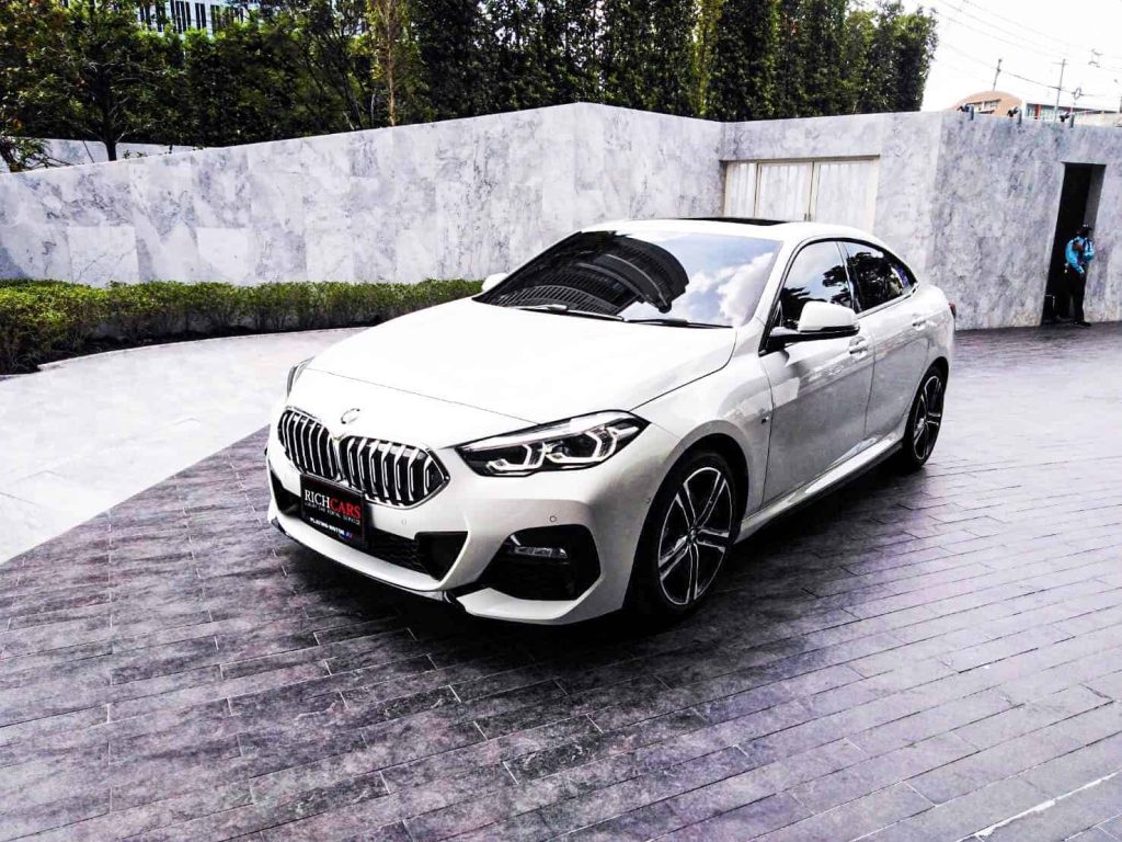 Starting at 8,900 Baht/1 Day

**BMW 2 Series Gran Coupe 2021: A Dynamic Fusion of Style and Performance**

Unleash a perfect blend of style and performance with the BMW 2 Series Gran Coupe 2021, a dynamic four-door coupe that redefines the driving experience. Launched in 2021, this Gran Coupe combines striking aesthetics with powerful performance, offering a compelling choice for those seeking a sporty and luxurious compact sedan.

*Performance:*
- **Engine Options:** Multiple engine options, including a range of efficient and powerful choices.
- **Horsepower:** Varied power outputs for an engaging driving experience.
- **Transmission:** Smooth and responsive automatic transmission options.
- **Top Speed:** Impressive top speeds for an exhilarating ride.

*Distinctive Features:*
- Striking Exterior Design
- Advanced Driving Dynamics
- Cutting-edge Technology Integration
- Luxurious Interior Comforts

*Luxurious Interior:*
- Premium Materials and Finishes
- Innovative Infotainment System
- Driver-Assistance Features for Enhanced Safety
- Comfortable and Spacious Cabin

*Price:*
The BMW 2 Series Gran Coupe 2021 offers a harmonious balance of style and performance with a starting price that reflects its premium features and capabilities.

*Pros and Cons:*
*Pros:*
- Striking Exterior Design
- Powerful Performance Options
- Innovative Technology Features
- Luxurious Interior Comfort
- Advanced Safety Features

*Cons:*
- Premium Price Point
- Limited Cargo Space
- Relatively Compact Rear Seating

The BMW 2 Series Gran Coupe 2021 is a dynamic and stylish choice, offering a perfect balance of performance and luxury. With its captivating design and advanced features, it caters to enthusiasts seeking a premium compact sedan experience.