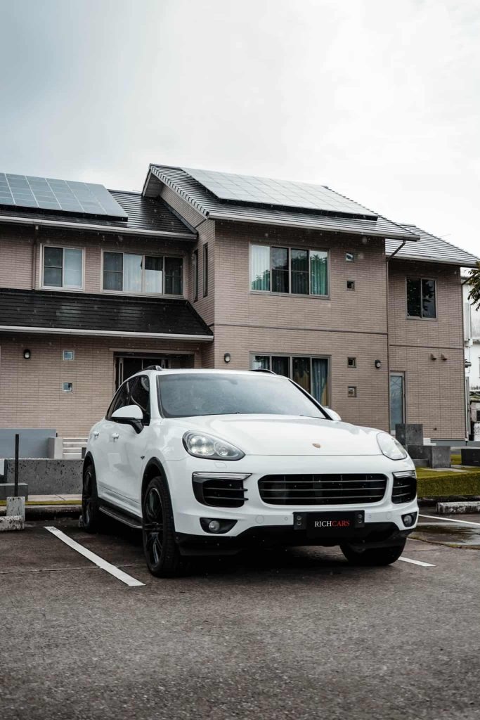 Starting at 24,900 Baht/1 Day

**Engine Options:**

The Porsche Cayenne S E-Hybrid 2019 is an exceptional SUV that boasts a hybrid powertrain introduced in 2019, marking it as one of the world's pioneering hybrid SUVs.

Powered by a 3.0-liter V6 gasoline engine with a turbocharger, the Cayenne S E-Hybrid 2019 delivers an impressive maximum power of 462 horsepower. This formidable engine collaborates seamlessly with an electric motor, contributing an additional 110 horsepower. The combined result is a peak power of 472 horsepower and a robust peak torque of 516 Newton-meters. The Cayenne S E-Hybrid 2019 can achieve a top speed of 253 kilometers per hour, and its fuel efficiency is noteworthy, averaging 18.3 kilometers per liter.

**Cayenne S E-Hybrid 2019 Features:**

- **Adaptive Suspension:** The SUV is equipped with an adaptive air suspension system, allowing for four adjustable ride heights.
- **Braking System:** Incorporating a carbon-ceramic brake system, the Cayenne S E-Hybrid 2019 ensures shorter stopping distances compared to traditional metal brakes.
- **Power Distribution:** An automatic 8-speed transmission, intelligent all-wheel drive, and a smart wheel drive distribution system enhance the SUV's performance.

**Pros and Cons:**

*Pros:*
- Outstanding performance
- Cutting-edge technology
- Elegant design
- Fuel efficiency
- Comfortable and spacious interior
- Versatile cargo capacity

*Cons:*
- High price
- Expensive maintenance
- Challenging repairs
- Limited rear cargo space
- Slightly narrow rear seating

**Price and Availability:**

The Porsche Cayenne S E-Hybrid 2019 received global acclaim for its impressive performance, innovative technology, and stylish design. It set a high standard as one of the best hybrid SUVs globally in 2019.